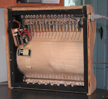 View of the underside of the controller, showing the sliders and electronics.